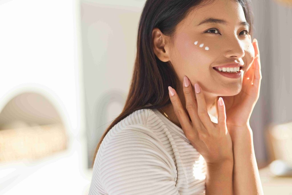 radiant woman applying cream to her face 2026 01 08 06 41 14 utc (1)