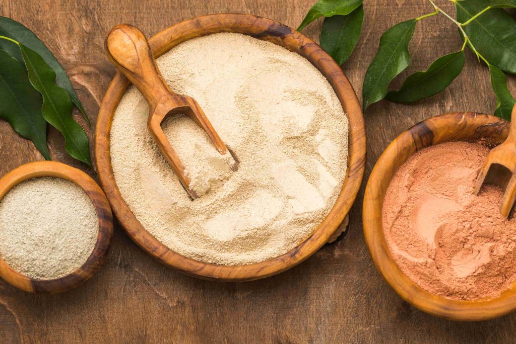 flat lay selection fine powders bowls with scoops (1)