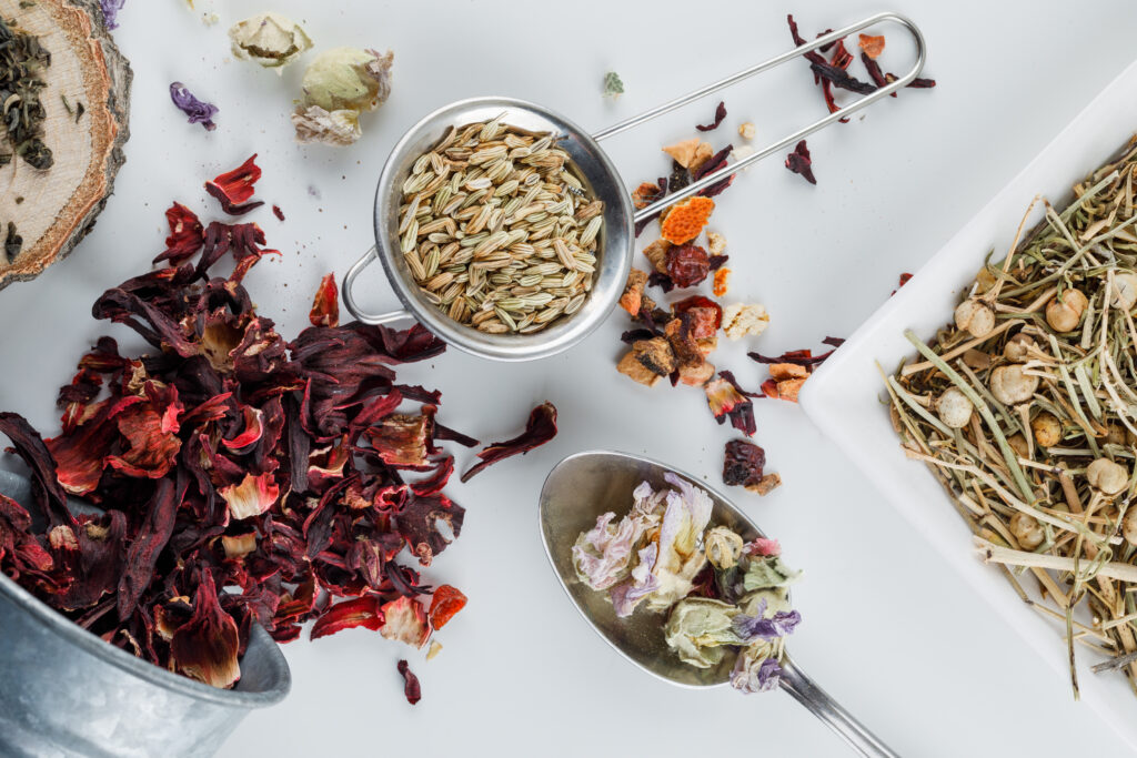 Anise Small Sieve With Various Dried Herbs Flat Lay White Surface 1 1024x683
