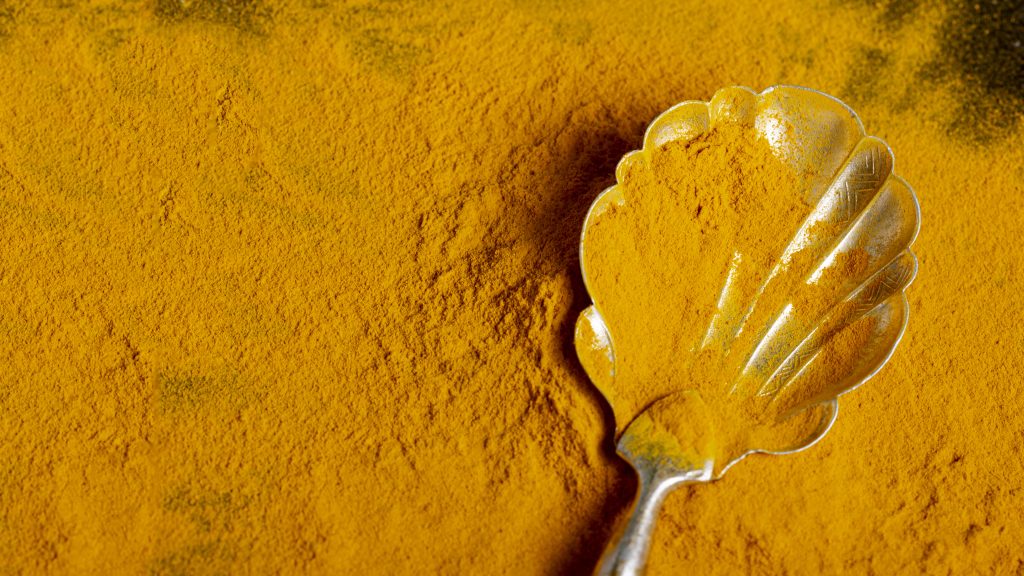 Top View Spoon With Turmeric With Copy Space 1024x576