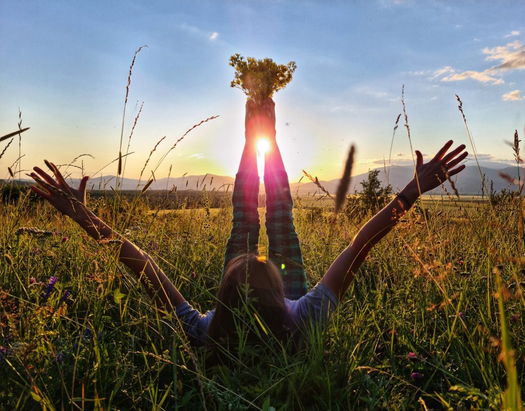 A Woman Lies In A Meadow With Her Legs Raised And 2025 01 08 23 18 17 Utc 1 1024x802