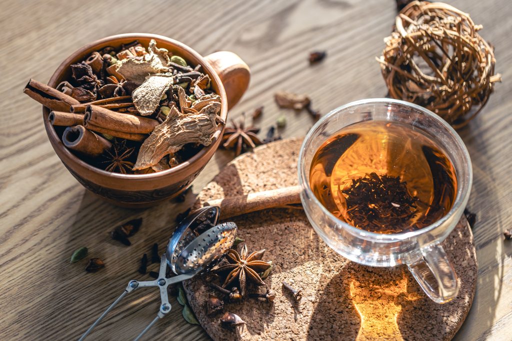 Fragrant Hot Tea With Cinnamon Wooden Table Top View 1024x683
