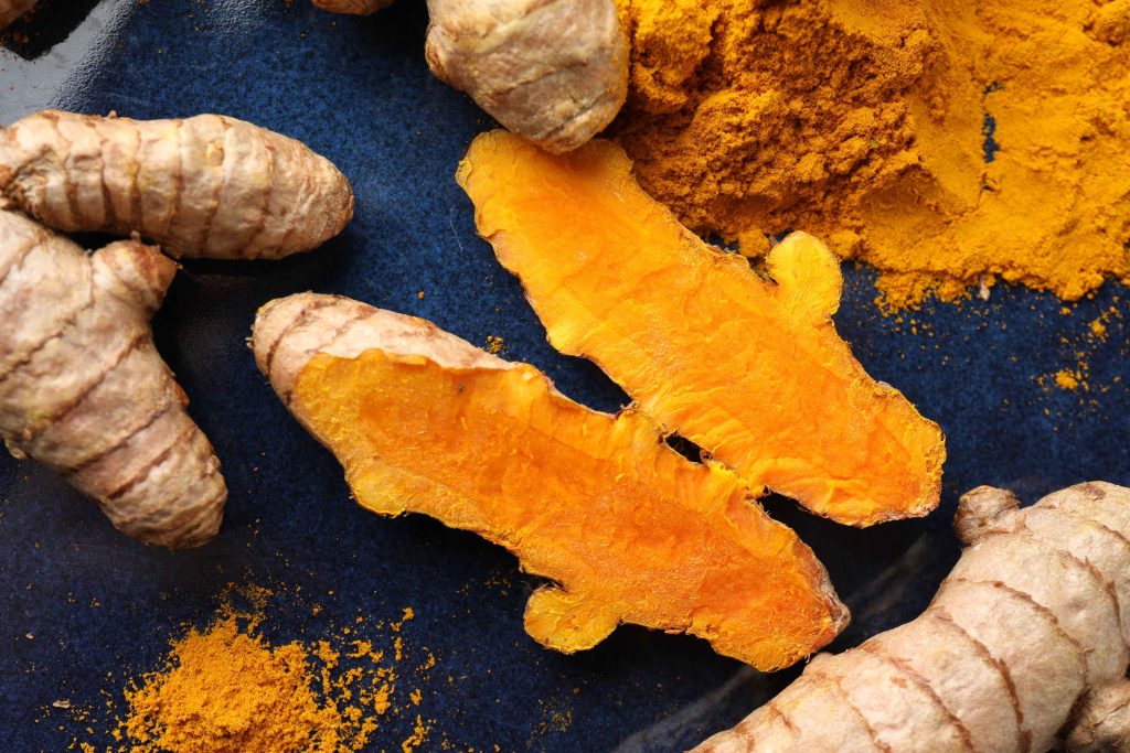 Aromatic Turmeric Powder And Fresh Roots On Blue P 2026 01 11 11 04 52 Utc 1 1024x683