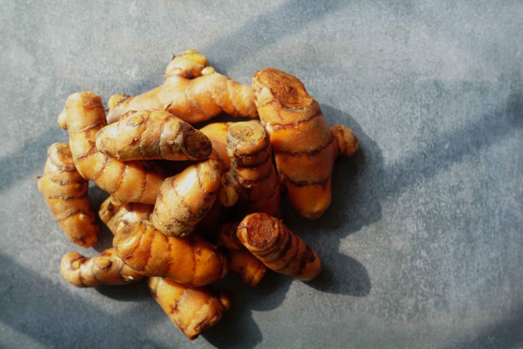 Turmeric Roots Displayed On A Textured Grey Surfac 2026 01 09 11 56 35 Utc 1 1024x683